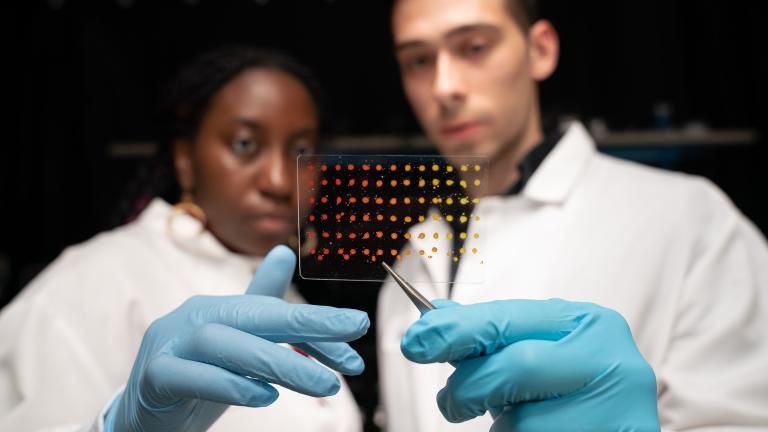 MIT graduate students Eunice Aissi, left, and Alexander Siemenn, have developed a technique that automatically analyzes visual features in printed samples (pictured) to quickly determine key properties of new and promising semiconducting materials.