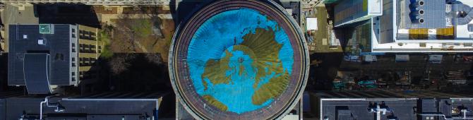 A bird's eye view of the MIT dome, covered to look like the Earth