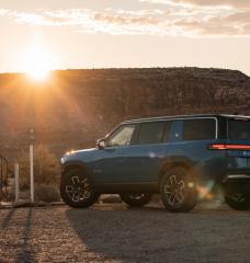 Image of electric Rivian vehicle at charging station