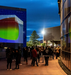 Onlookers gathered at the site of the interactive Climate Machine art installation on April 19.