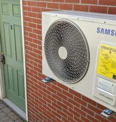 A heat pump is installed on a condo building in Portland's West End