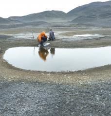 Marc Shallenberg samples from a pond.