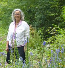 Debbi Edelstein standing in a field 