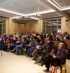 Attendees examine the ideas and information under discussion during the first "Civil Discourse" event at MIT. 