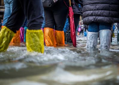 keeping dry during a flood in Venice, Italy